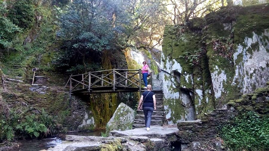 Waterfall and woodland near Fraga da Pena